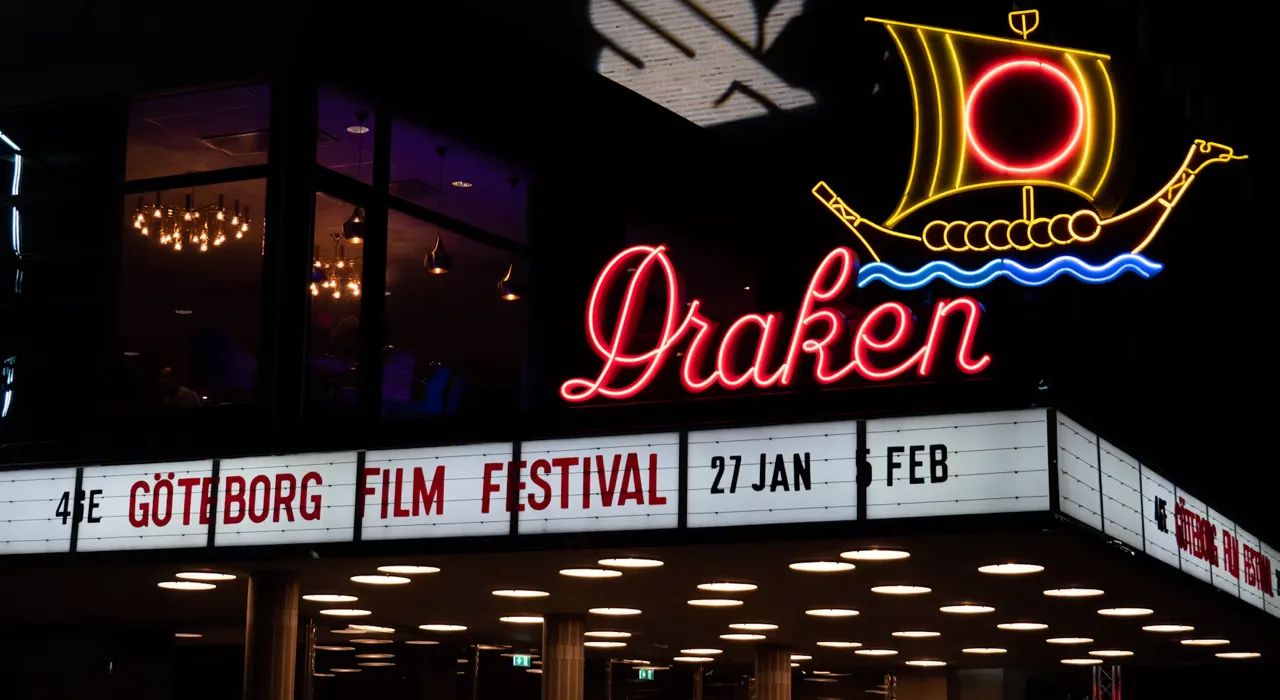 A neon Draken cinema sign with a Viking ship above a marquee for the 46th Göteborg Film Festival, January 27 to February 5.